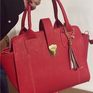 Stylish Red Satchel with Tassel Accent